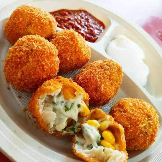 CHEESE CORN KURKURE MOMOS